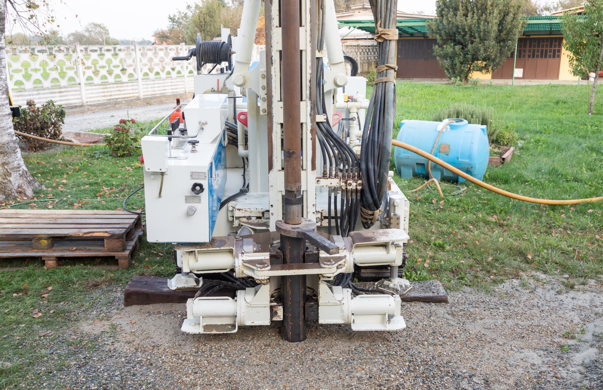 Mobile water well drilling rig on a residential site